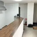 松戸市上本郷 1階サービスルーム（納戸）約10.5帖。玄関方向。