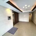 ライオンズ多摩川レジデンス 白を基調とした清潔感のある風除室